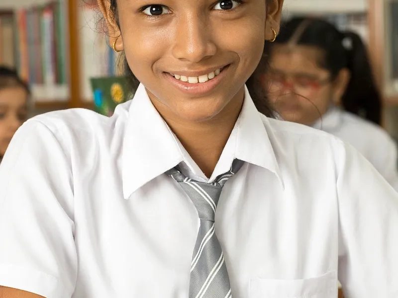 Smiling student in school uniform
